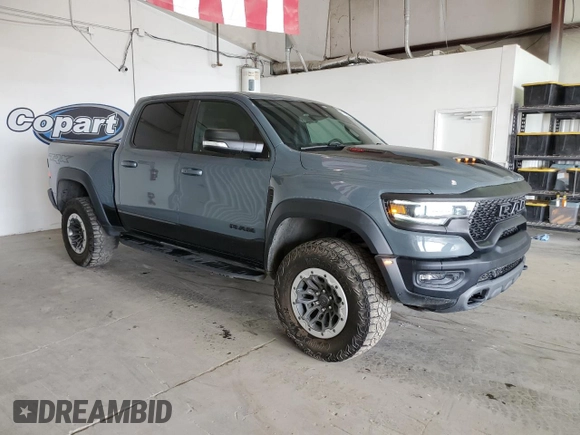 2021 Ram 1500 with VIN 0K1905786880, listed as a Copart auction lot 61756114 with 34,927 mi miles and Clean title. Bid and sale history available at DreamBid. Image 4.
