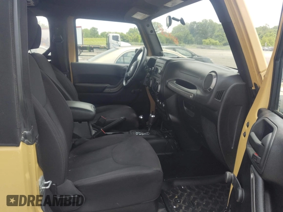 2013 Jeep Wrangler Sport with VIN 1C4AJWAG1DL672816, listed as a IAAI auction lot 42597238 with 105,910 mi miles and . Bid and sale history available at DreamBid. Image 5.
