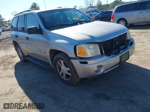 2004 GMC Envoy SLE with VIN 1GKDT13S642213710, listed as a IAAI auction lot 41680656 with 239,187 mi miles. Bid and sale history available at carsss.com. Image 1.