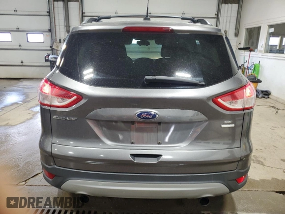 2013 Ford Escape SE with VIN 1FMCU9G96DUB33138, listed as a Copart auction lot 61851665 with 148,742 mi miles and Salvage title. Bid and sale history available at DreamBid. Image 6.