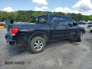 2011 Nissan Titan Pro-4X with VIN 1N6BA0EC6BN313680, listed as a Copart auction lot 60335995 with 241,301 mi miles and Salvage title. Bid and sale history available at DreamBid. Image 3.