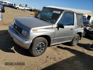 1995 Chevrolet Tracker z VIN 2CNBJ186XS6926688, wystawiony jako Copart lot #77487204 z przebiegiem 17 598 mil mil oraz Szkoda całkowita • Salvage title. Historia ofert i sprzedaży dostępna na DreamBid. Obrazek 1.