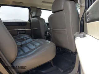 2003 Hummer H2 with VIN 5GRGN23U73H122756, listed as a IAAI auction lot 42194176 with 239,411 mi miles. Bid and sale history available at carsss.com. Image 8.