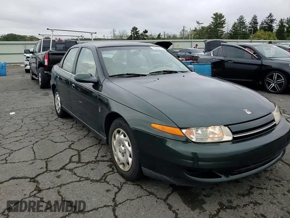 2001 Saturn LS z VIN 1G8JU54F41Y581083, wystawiony jako Copart lot #73123714 z przebiegiem 98 500 mil mil oraz Szkody całkowita. Historia ofert i sprzedaży dostępna na DreamBid. Obrazek 10.