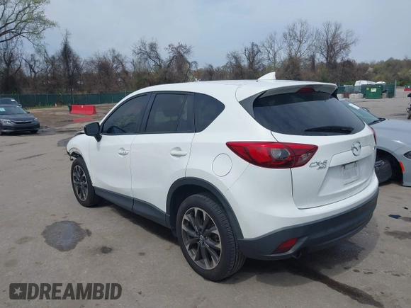 2016 Mazda CX-5 Grand Touring with VIN JM3KE4DY6G0618121, listed as a IAAI auction lot 41958805 with 101,232 mi miles. Bid and sale history available at carsss.com. Image 3.