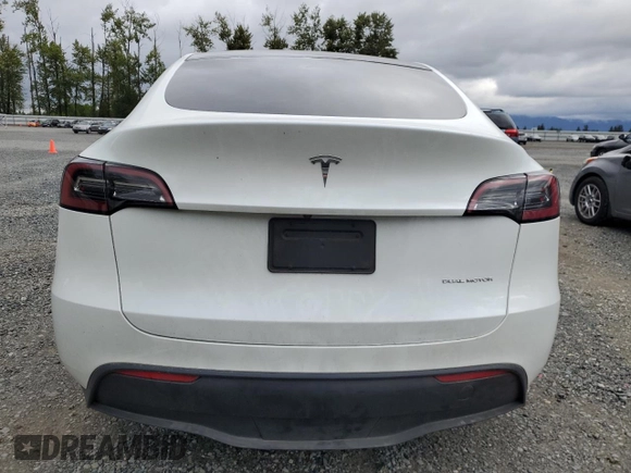2023 Tesla Model Y Long Range z VIN 7SAYGDEE3PF751019, wystawiony jako Copart lot #57972885 z przebiegiem 24 591 mil mil oraz Szkoda całkowita • Salvage title. Historia ofert i sprzedaży dostępna na DreamBid. Obrazek 6.