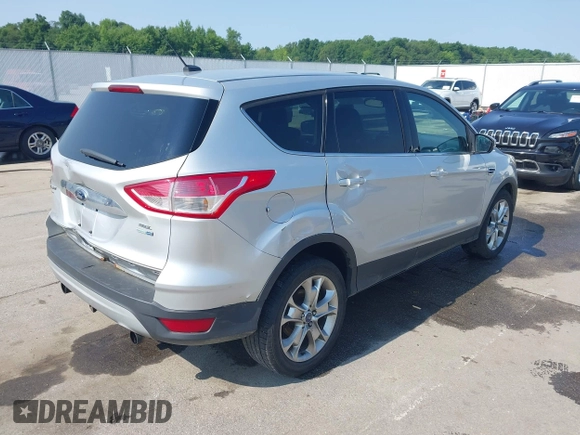 2013 Ford Escape SEL with VIN 1FMCU9H99DUA11243, listed as a IAAI auction lot 42356731 with 154,937 mi miles and . Bid and sale history available at DreamBid. Image 4.