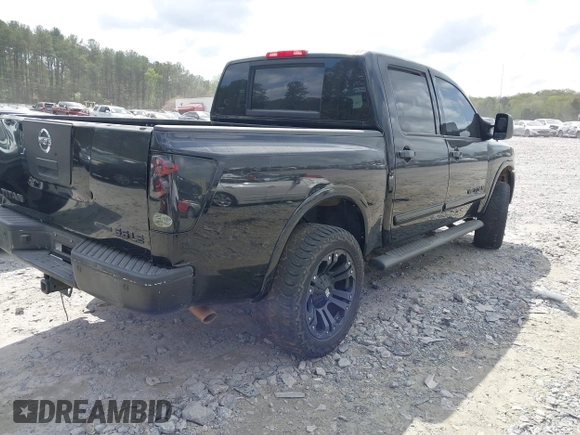 2009 Nissan Titan LE with VIN 1N6BA07D79N317253, listed as a IAAI auction lot 41944642 with 231,896 mi miles. Bid and sale history available at carsss.com. Image 4.