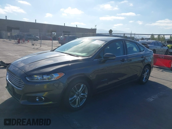 2016 Ford Fusion SE Hybrid z VIN 3FA6P0LU6GR145421, wystawiony jako IAAI lot #42650918 z przebiegiem 105 990 mil mil oraz . Historia ofert i sprzedaży dostępna na DreamBid. Obrazek 6.
