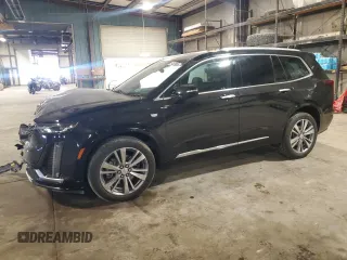 2020 Cadillac XT6 FWD Premium Luxury with VIN 1GYKPCRSXLZ154638, listed as a Copart auction lot 57439835 with 142,435 mi miles and Salvage title. Bid and sale history available at DreamBid. Image 1.