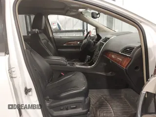 2011 Lincoln MKX with VIN 2LMDJ8JK8BBJ34012, listed as a IAAI auction lot 41524792 with 142,670 mi miles. Bid and sale history available at carsss.com. Image 5.