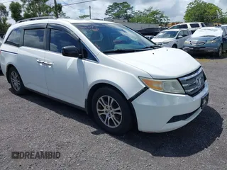 2012 Honda Odyssey EX-L with VIN 5FNRL5H60CB051797, listed as a IAAI auction lot 41789511 with 120,268 mi miles and . Bid and sale history available at DreamBid. Image 1.