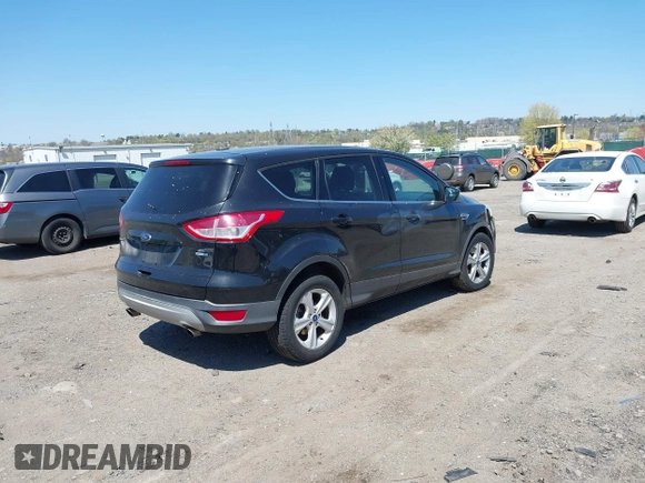 2015 Ford Escape SE with VIN 1FMCU9GX3FUC14020, listed as a IAAI auction lot 42069921 with 111,113 mi miles. Bid and sale history available at carsss.com. Image 4.