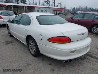 2000 Chrysler LHS with VIN 2C3HC56G4YH382301, listed as a IAAI auction lot 41324699 with 220,076 mi miles. Bid and sale history available at carsss.com. Image 3.