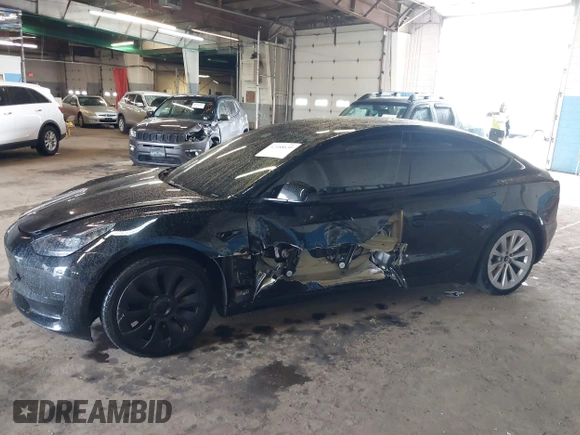 2023 Tesla Model 3 with VIN 5YJ3E1EA5PF396413, listed as a IAAI auction lot 42188639 with 57,717 mi miles and . Bid and sale history available at DreamBid. Image 6.
