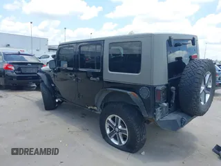2008 Jeep Wrangler Unlimited Sahara with VIN 1J4GB59198L619802, listed as a IAAI auction lot 42361793 with 272,295 mi miles and . Bid and sale history available at DreamBid. Image 3.