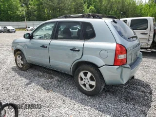 2005 Hyundai Tucson GL with VIN KM8JM12B05U148660, listed as a Copart auction lot 54302805 with 257,233 mi miles and Salvage title. Bid and sale history available at DreamBid. Image 2.