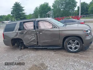 2016 Chevrolet Tahoe LT z VIN 1GNSCBKC2GR420861, wystawiony jako IAAI lot #42205983 z przebiegiem 149 680 mil mil oraz . Historia ofert i sprzedaży dostępna na DreamBid. Obrazek 14.
