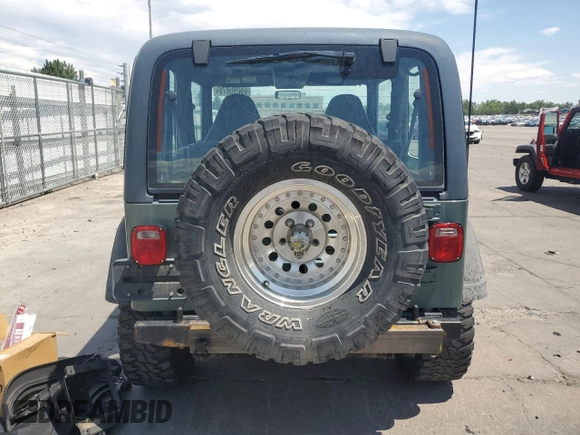 2000 Jeep Wrangler Sport с VIN 1J4FA49S4YP710633, выставлен на аукционе Copart как лот 65095875 с пробегом 107 613 миль миль и Чистый • Clean title. История ставок и продаж доступна на DreamBid. Изображение 6.
