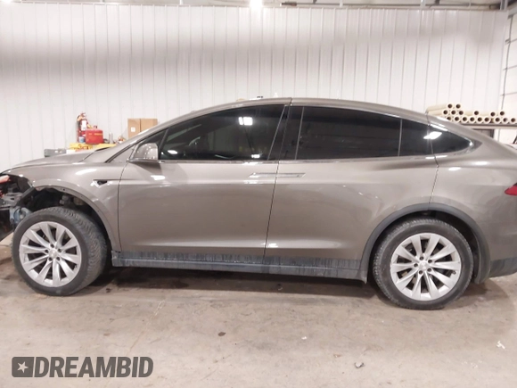 2016 Tesla Model X 70D with VIN 5YJXCBE27GF004974, listed as a IAAI auction lot 41630556 with 167,709 mi miles. Bid and sale history available at carsss.com. Image 15.