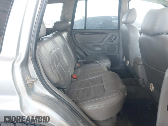 2002 Jeep Grand Cherokee Limited with VIN 1J8GW58J62C165942, listed as a IAAI auction lot 42739339 with 220,677 mi miles and . Bid and sale history available at DreamBid. Image 8.