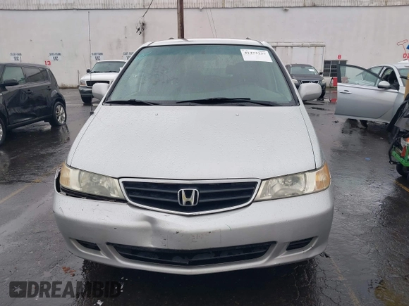 2004 Honda Odyssey EX-L with VIN 5FNRL18934B016420, listed as a IAAI auction lot 41473237 with 188,659 mi miles and . Bid and sale history available at DreamBid. Image 12.