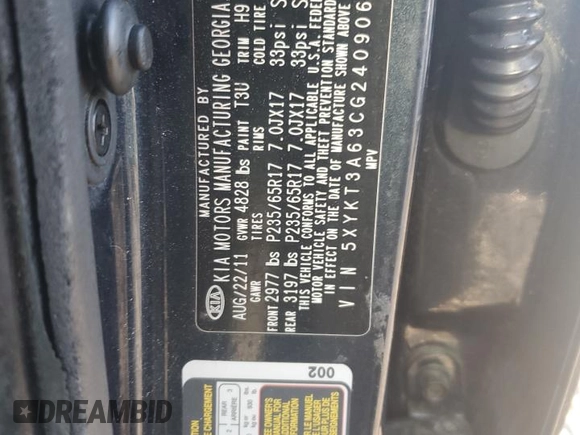 2012 Kia Sorento LX z VIN 5XYKT3A63CG240906, wystawiony jako Copart lot #52706915 z przebiegiem 182 518 mil mil oraz Szkoda całkowita • Salvage title. Historia ofert i sprzedaży dostępna na DreamBid. Obrazek 14.