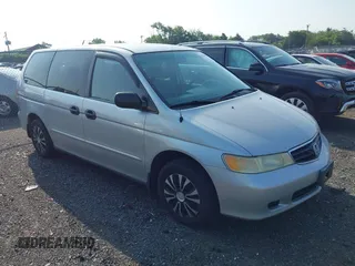 2004 Honda Odyssey LX with VIN 5FNRL18544B083525, listed as a IAAI auction lot 42786857 with 228,214 mi miles and . Bid and sale history available at DreamBid. Image 1.