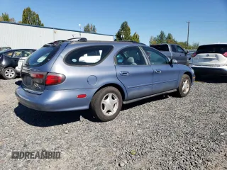 1999 Ford Taurus SE Standard with VIN 1FAFP58U9XG271897, listed as a Copart auction lot 73048784 with 190,518 mi miles and Salvage title. Bid and sale history available at DreamBid. Image 3.