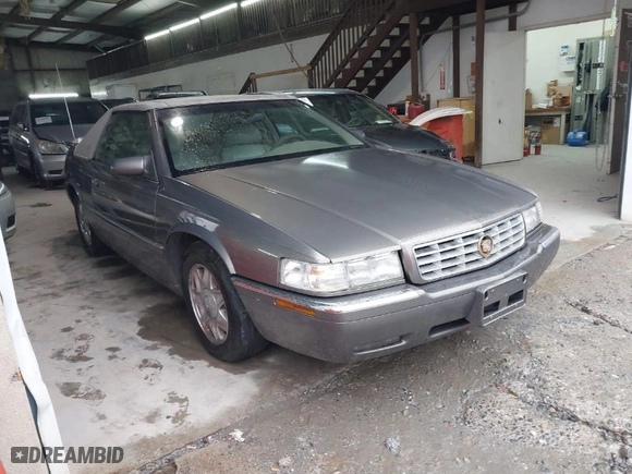1999 Cadillac Eldorado ESC with VIN 1G6EL12Y8XU612393, listed as a IAAI auction lot 41761839 with 104,994 mi miles. Bid and sale history available at carsss.com. Image 1.
