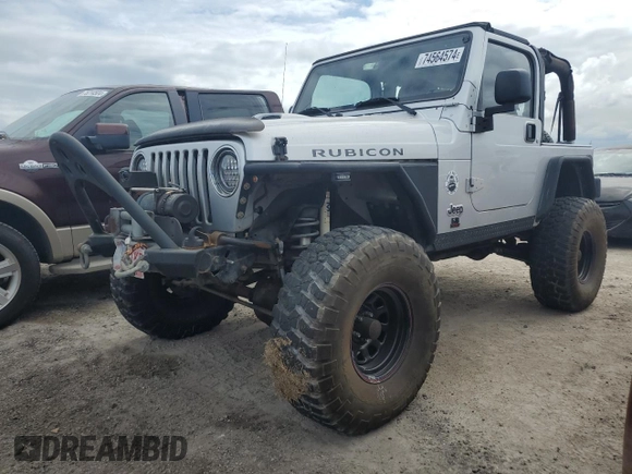 2003 Jeep Wrangler Rubicon z VIN 1J4FA69S53P340085, wystawiony jako Copart lot #74564574 z przebiegiem Nie podano mil oraz Szkoda całkowita • Salvage title. Historia ofert i sprzedaży dostępna na DreamBid. Obrazek 1.