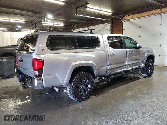 2021 Toyota Tacoma 4WD SR5 with VIN 3TMDZ5BN3MM103509, listed as a Copart auction lot 48461875 with 54,566 mi miles and Salvage Title. Bid and sale history available at carsss.com. Image 3.