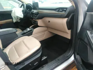 2020 Ford Escape Titanium Hybrid with VIN 1FMCU0DZ8LUB13911, listed as a IAAI auction lot 41249498 with 64,108 mi miles and . Bid and sale history available at DreamBid. Image 5.