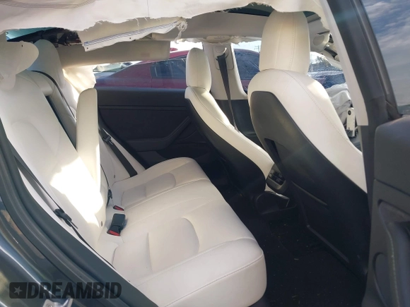 2021 Tesla Model 3 Long Range with VIN 5YJ3E1EB6MF975916, listed as a IAAI auction lot 40713749 with 29,593 mi miles and . Bid and sale history available at DreamBid. Image 8.