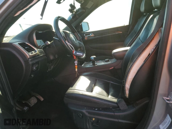 2014 Jeep Grand Cherokee Overland with VIN 1C4RJFCG2EC281062, listed as a Copart auction lot 47099225 with 127,660 mi miles and Salvage Title. Bid and sale history available at carsss.com. Image 7.
