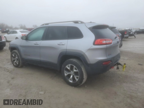 2014 Jeep Cherokee Trailhawk with VIN 1C4PJMBS1EW240177, listed as a Copart auction lot 43321715 with 212,339 mi miles and Salvage title. Bid and sale history available at DreamBid. Image 2.