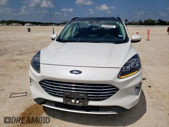 2021 Ford Escape Titanium Hybrid z VIN 1FMCU0DZ6MUA03327, wystawiony jako Copart lot #59558845 z przebiegiem 67 569 mil mil oraz Czysty tytuł • Clean title. Historia ofert i sprzedaży dostępna na DreamBid. Obrazek 5.