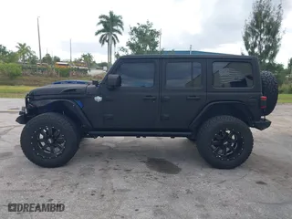 2018 Jeep Wrangler Unlimited Sport S with VIN 1C4HJXDG2JW228483, listed as a IAAI auction lot 41710364 with 56,970 mi miles. Bid and sale history available at carsss.com. Image 14.