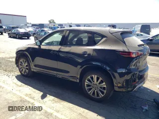 2024 Mazda CX-5 2.5 Turbo Signature with VIN JM3KFBXY4R0388868, listed as a Copart auction lot 73435824 with 5,540 mi miles and Salvage Title. Bid and sale history available at carsss.com. Image 2.