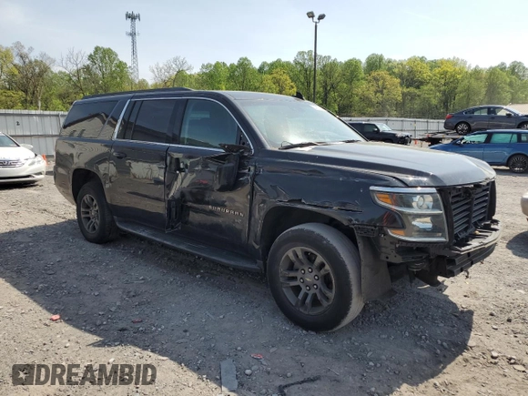 2019 Chevrolet Suburban LT with VIN 1GNSCHKC2KR167309, listed as a Copart auction lot 54475565 with 140,552 mi miles and Salvage Title. Bid and sale history available at DreamBid. Image 4.