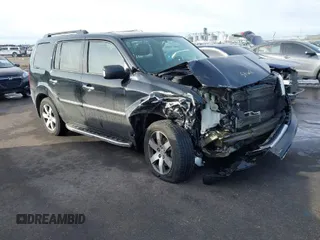2015 Honda Pilot Touring with VIN 5FNYF4H90FB009528, listed as a IAAI auction lot 41652038 with 178,811 mi miles. Bid and sale history available at carsss.com. Image 1.