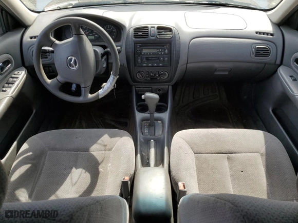 2000 Mazda Protege DX with VIN JM1BJ222XY0199683, listed as a Copart auction lot 50010565 with 139,428 mi miles and Salvage Title. Bid and sale history available at carsss.com. Image 8.