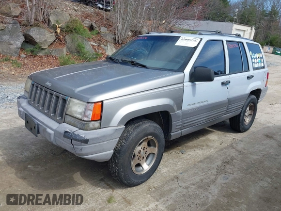 1996 Jeep Grand Cherokee Laredo with VIN 1J4EX58S1TC122268, listed as a IAAI auction lot 42005236 with 288,466 mi miles. Bid and sale history available at carsss.com. Image 2.