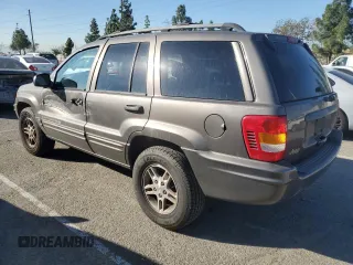 1999 Jeep Grand Cherokee Limited with VIN 1J4G268SXXC759016, listed as a Copart auction lot 80307534 with 215,870 mi miles and Salvage title. Bid and sale history available at DreamBid. Image 2.