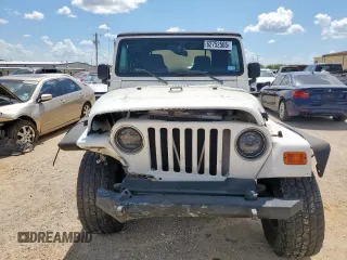 2004 Jeep Wrangler Sport z VIN 1J4FA49SX4P802341, wystawiony jako Copart lot #62752565 z przebiegiem 150 197 mil mil oraz Szkoda całkowita • Salvage title. Historia ofert i sprzedaży dostępna na DreamBid. Obrazek 5.