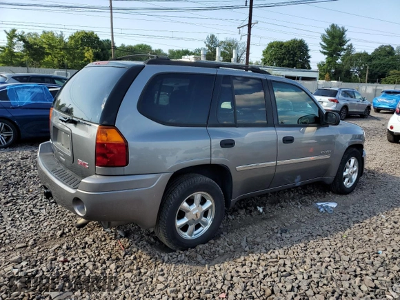 2006 GMC Envoy SLT with VIN 1GKDT13S962305588, listed as a Copart auction lot 69196964 with 118,289 mi miles and Salvage Title. Bid and sale history available at DreamBid. Image 3.