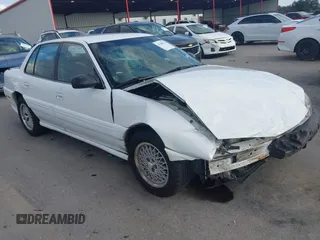 1997 Pontiac Grand Am SE with VIN 1G2NE52T3VC809661, listed as a IAAI auction lot 41100711 with 168,686 mi miles. Bid and sale history available at carsss.com. Image 1.