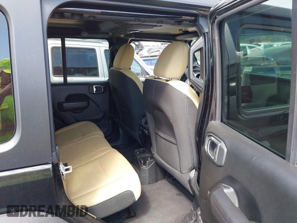 2023 Jeep Wrangler Sport S with VIN 1C4HJXDN6PW599895, listed as a IAAI auction lot 42242107 with 53,980 mi miles and . Bid and sale history available at DreamBid. Image 8.