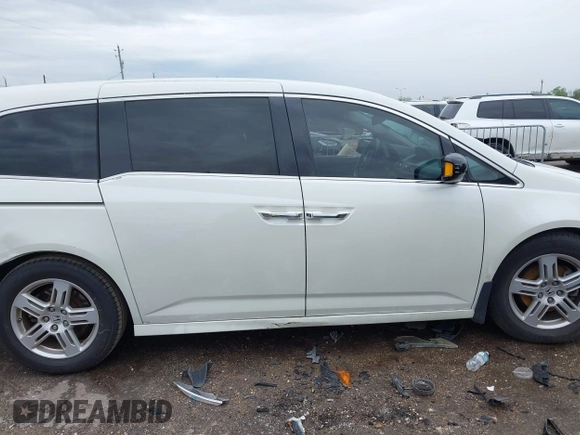 2013 Honda Odyssey Touring with VIN 5FNRL5H96DB074819, listed as a IAAI auction lot 41898358 with 123,428 mi miles and . Bid and sale history available at carsss.com. Image 13.