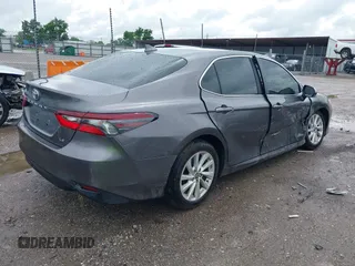 2024 Toyota Camry LE z VIN 4T1C11AK2RU879602, wystawiony jako IAAI lot #42162353 z przebiegiem 6 185 mil mil oraz . Historia ofert i sprzedaży dostępna na DreamBid. Obrazek 4.